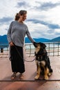 Woman and dog on a leash, on the ferry.