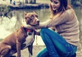 Woman with dog nature playing together Royalty Free Stock Photo