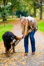 Woman and dog at retrieving stick game