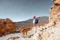 Woman with dog on the rocky terrain Royalty Free Stock Photo