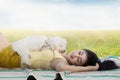 Woman and dog sleeping on the meadow Royalty Free Stock Photo