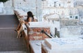 Woman with a dog in the street, Italy