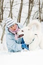 Woman with a dog in winter on walk Royalty Free Stock Photo