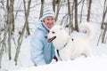 The woman with a dog in winter walk Royalty Free Stock Photo