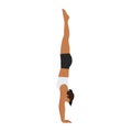 Woman doing Adho Mukha vrksasana or handstand pose yoga exercise