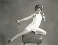 Woman doing arm exercises on vaulting horse Royalty Free Stock Photo