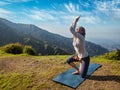 Woman doing Ashtanga Vinyasa yoga advanced asana Royalty Free Stock Photo