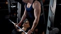 Woman doing barbell bench press in gym, exercise under trainer supervision Royalty Free Stock Photo