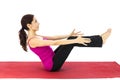 Woman doing boat pose in yoga