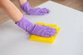 Woman doing chores at home with spray detergent suds sponge. Cropped view Royalty Free Stock Photo