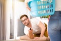 Woman doing chores while man watching tv Royalty Free Stock Photo