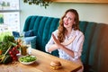 Woman doing cross arms sign to refuse junk food or fast food hamburger and potato fried that have many fat. Dieting for good