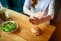 Woman doing cross arms sign to refuse junk food or fast food hamburger and potato fried that have many fat. Dieting for good