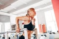 Woman doing dips in the gym