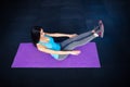 Woman doing excercise on yoga mat Royalty Free Stock Photo