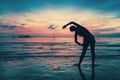 Woman doing exercises on the beach during sunset. Royalty Free Stock Photo