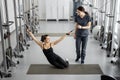 Woman doing exercises on decompression simulators with the help of rehabilitation specialist Royalty Free Stock Photo