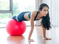 Woman doing exercises with fit ball in fitness gym Royalty Free Stock Photo