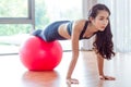 Woman doing exercises with fit ball in fitness gym Royalty Free Stock Photo