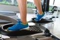 Woman doing exercises in the gym on elliptical cross trainer Royalty Free Stock Photo