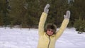 A woman is doing exercises with inclines in the winter forest. Healthy lifestyle.