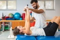 Woman doing exercises with medical bar