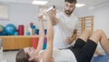 Woman doing exercises with medical bar