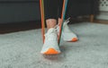 Woman doing exercises with resistance bands