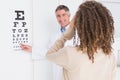 Woman doing eye test with optometrist Royalty Free Stock Photo