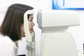 Woman doing eye test with optometrist in medical office Royalty Free Stock Photo