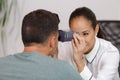 woman doing eye test with optometrist in eye sight clinic Royalty Free Stock Photo