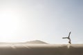 Woman doing handstand in desert Royalty Free Stock Photo