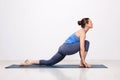 Woman doing Hatha yoga asana Anjaneyasana Royalty Free Stock Photo