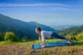 Woman doing Hatha yoga asana plank pose outdoors Royalty Free Stock Photo