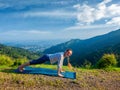 Woman doing Hatha yoga asana plank pose outdoors Royalty Free Stock Photo