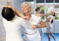 Woman doing a head kick during self defense training