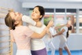 Woman doing a head kick during self defense training