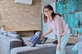 Woman doing house cleaning with vacuum cleaner Royalty Free Stock Photo