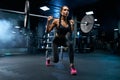 Woman doing lunges using barbell in gym. Royalty Free Stock Photo