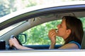 Woman doing make-up in car