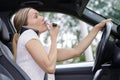 woman doing make-up in car Royalty Free Stock Photo