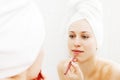 Woman doing make-up after shower Royalty Free Stock Photo