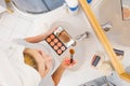 Woman doing makeup in front of mirror Royalty Free Stock Photo