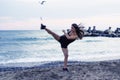 Woman doing martial arts at the beach Royalty Free Stock Photo