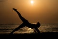 Woman Doing Meditation Near Ocean Beach Yoga Silhouette Royalty Free Stock Photo