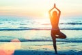 Woman doing meditation near the ocean. Royalty Free Stock Photo