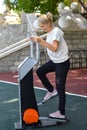 Woman doing physical exercise in a public park in summer outdoor, Royalty Free Stock Photo