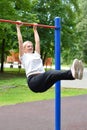 Woman doing physical exercise in a public park in summer outdoor, Royalty Free Stock Photo