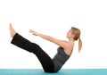 Woman doing Pilates teaser pose Royalty Free Stock Photo