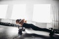 Woman doing push-ups exercises on kettlebells. Cross fit training